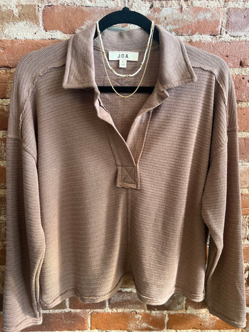 Brown exposed seam top